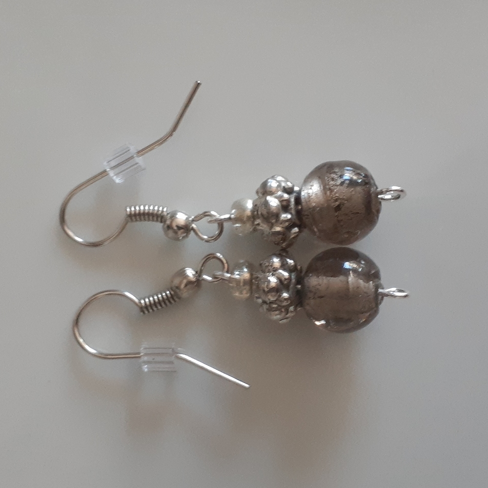 Stunning handcrafted boho earrings .
